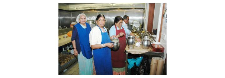 ladies preparing food in the kitchen at GHS